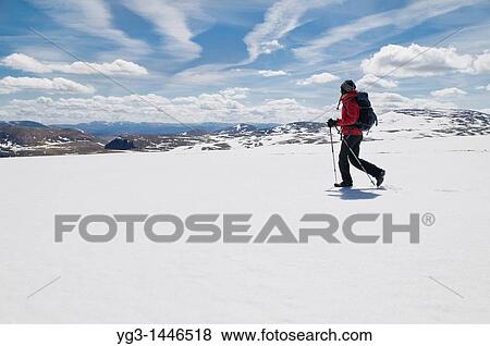 Female hiker in red jacket crosses snowfield near summit of Cairn Lochan in the Cairngorm mountains, Scotland View Large Photo Image Stock Photo - Female hiker in red jacket crosses snowfield near summit of Cairn Lochan in the Cairngorm mountains, Scotland. Fotosearch