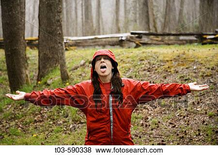 Female hiker makes the best of an April shower in Great Smoky Mountains National Park, Tennessee, USA. View Large Photo Image Stock Photo - Female hiker makes the best of an April shower in Great Smoky Mountains National Park, Tennessee, USA.. Fotosearch