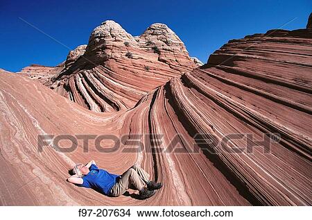 Female hiker. Navajo Sandstone. Coyote Buttes. Arizona. USA View Large Photo Image Picture - Female hiker. Navajo Sandstone. Coyote Buttes. Arizona. USA. Fotosearch