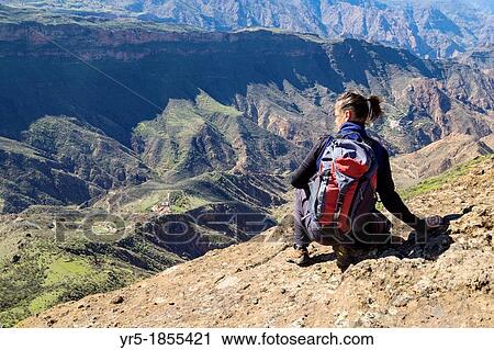 Female hiker near summit of Roque Bentayga near Tejeda on Gran Canaria, Canary Islands, Spain View Large Photo Image Stock Image - Female hiker near summit of Roque Bentayga near Tejeda on Gran Canaria, Canary Islands, Spain. Fotosearch