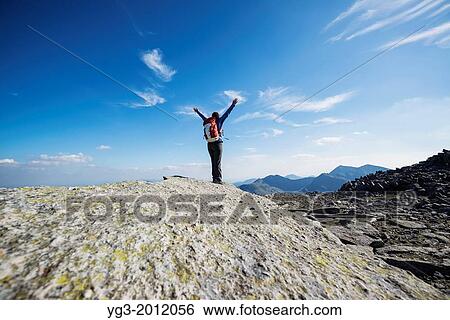 Female hiker on Cantilever stone, Glyder Fach, Snowdonia national park, Wales. View Large Photo Image Stock Photograph - Female hiker on Cantilever stone, Glyder Fach, Snowdonia national park, Wales.. Fotosearch