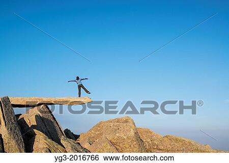 Female hiker on Cantilever stone, Glyder Fach, Snowdonia national park, Wales. View Large Photo Image Stock Photograph - Female hiker on Cantilever stone, Glyder Fach, Snowdonia national park, Wales.. Fotosearch
