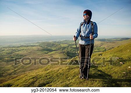 Female hiker on summit of Twmpa, Black Mountains, Brecon Beacons national park, Wales. View Large Photo Image Picture - Female hiker on summit of Twmpa, Black Mountains, Brecon Beacons national park, Wales.. Fotosearch