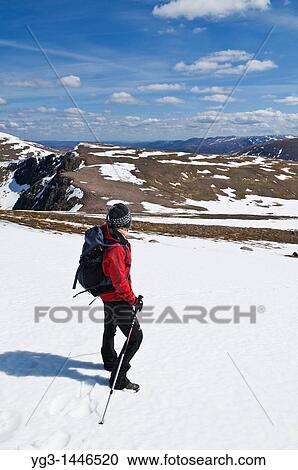 Female hiker takes in view of Cairngorms from Cairn Lochan on spring day, Highland, Scotland View Large Photo Image Stock Image - Female hiker takes in view of Cairngorms from Cairn Lochan on spring day, Highland, Scotland. Fotosearch