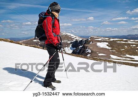 Female hiker takes in view of Cairngorms from Cairn Lochan on spring day, Highland, Scotland View Large Photo Image Stock Photo - Female hiker takes in view of Cairngorms from Cairn Lochan on spring day, Highland, Scotland. Fotosearch