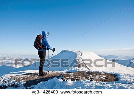 Female hiker viewing Pen Y Fan from Summit of Corn Du in winter, Brecon Beacons national park, Wales View Large Photo Image Stock Image - Female hiker viewing Pen Y Fan from Summit of Corn Du in winter, Brecon Beacons national park, Wales. Fotosearch