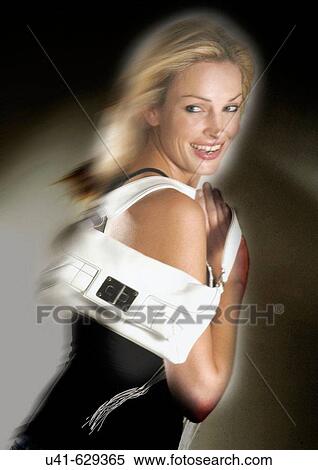 Female in a hurry carrying her handbag View Large Photo Image Stock Photography - Female in a hurry carrying her handbag. Fotosearch