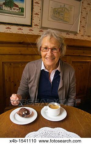 Female in her early 70s having coffee and cake Finland Europe View Large Photo Image Stock Image - Female in her early 70s having coffee and cake Finland Europe. Fotosearch