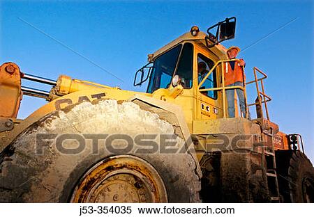 Female loader operator. I-880 Cypress project. Oakland, California. USA. View Large Photo Image Stock Photography - Female loader operator. I-880 Cypress project. Oakland, California. USA.. Fotosearch
