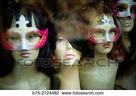 female mannequin heads with wigs and Venetian masks in the window of a hairdresser in Brixton, London, England, UK, Europe. View Large Photo Image Stock Image - female mannequin heads with wigs and Venetian masks in the window of a hairdresser in Brixton, London, England, UK, Europe.. Fotosearch