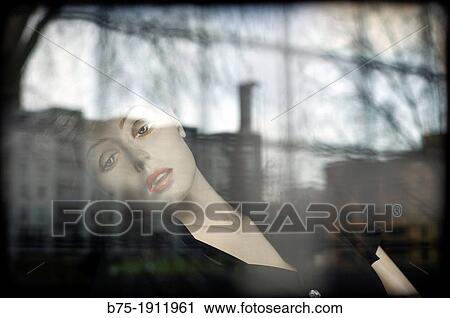 Female mannequin in a shop window with reflections, London, England, UK View Large Photo Image Stock Image - Female mannequin in a shop window with reflections, London, England, UK. Fotosearch