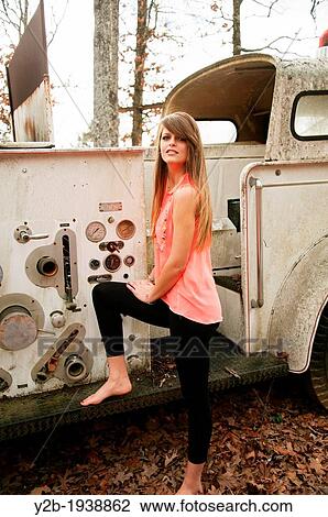 Female model by antique white fire truck View Large Photo Image Stock Image - Female model by antique white fire truck. Fotosearch