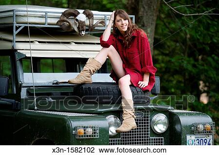 Female model in forest with 1966 Land Rover Series 2A 109 near Lewiston Maine USA View Large Photo Image Stock Image - Female model in forest with 1966 Land Rover Series 2A 109 near Lewiston Maine USA. Fotosearch