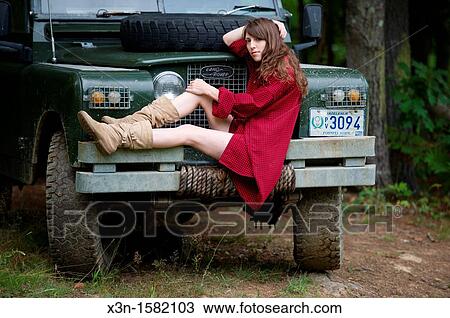 Female model in forest with 1966 Land Rover Series 2A 109 near Lewiston Maine USA View Large Photo Image Stock Image - Female model in forest with 1966 Land Rover Series 2A 109 near Lewiston Maine USA. Fotosearch