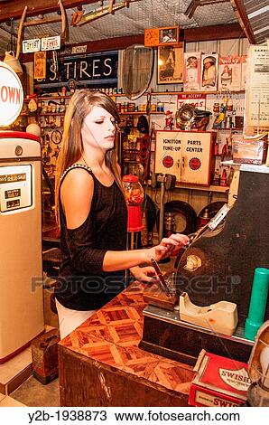 Female model in vintage service station View Large Photo Image Stock Image - Female model in vintage service station. Fotosearch