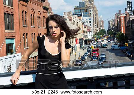 Stock Photography - Female model posing in the streets of New York. USA.. Fotosearch