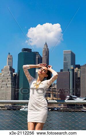 Female model posing on streets of New York. Manhattan. USA. View Large Photo Image Stock Photograph - Female model posing on streets of New York. Manhattan. USA.. Fotosearch