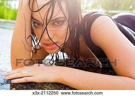 Female model posing on water surface. View Large Photo Image Stock Image - Female model posing on water surface.. Fotosearch