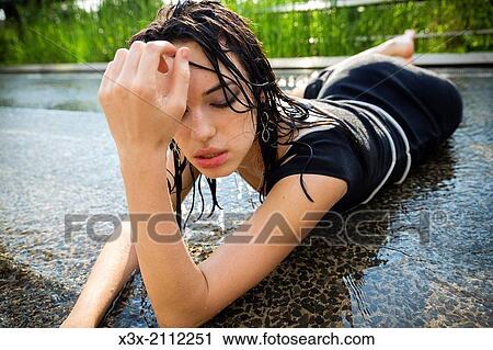 Female model posing on water surface. View Large Photo Image Stock Image - Female model posing on water surface.. Fotosearch