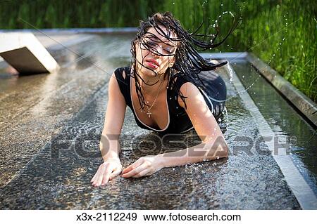 Female model posing on water surface. View Large Photo Image Stock Photo - Female model posing on water surface.. Fotosearch