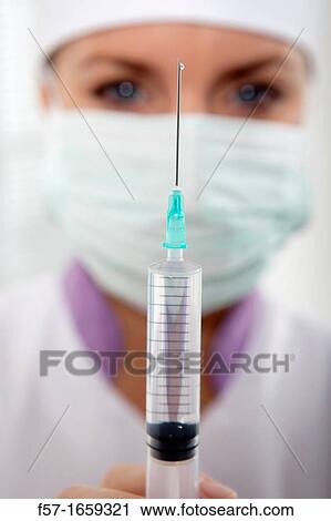 Female Nurse with a syringe View Large Photo Image Stock Image - Female Nurse with a syringe. Fotosearch