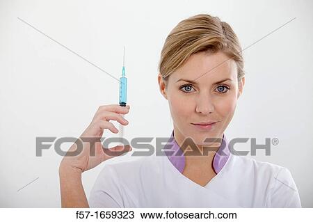 Female Nurse with a syringe View Large Photo Image Stock Image - Female Nurse with a syringe. Fotosearch