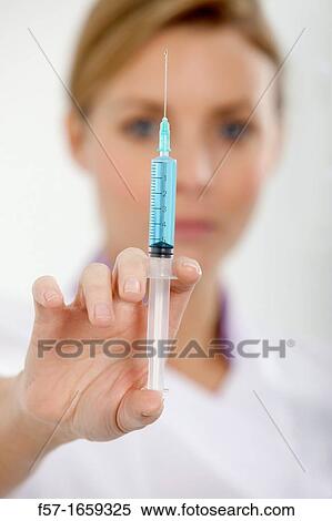 Female Nurse with a syringe View Large Photo Image Stock Photography - Female Nurse with a syringe. Fotosearch