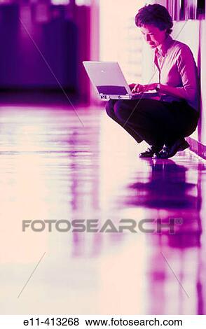 Female office worker with laptop View Large Photo Image Stock Photo - Female office worker with laptop. Fotosearch