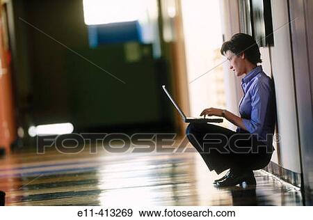 Female office worker with laptop View Large Photo Image Stock Photo - Female office worker with laptop. Fotosearch