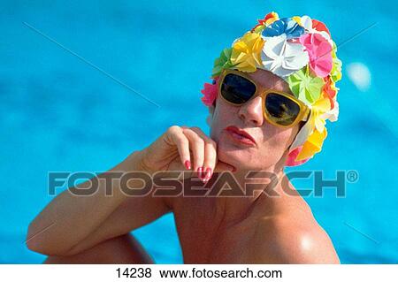 Stock Photo - Female portrait in floral swim cap. Fotosearch