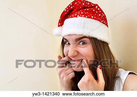 female santa portrait looking cute and funny indoors closeup View Large Photo Image Stock Image - female santa portrait looking cute and funny indoors closeup. Fotosearch