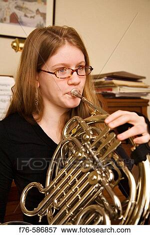 Female student practicing / playing french horn View Large Photo Image Stock Photo - Female student practicing / playing french horn. Fotosearch