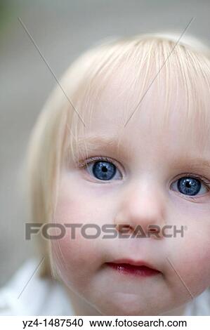Stock Image - Female toddler enjoying a day at the park. Fotosearch