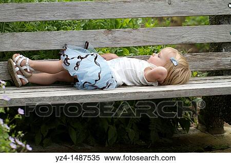 Stock Photography - Female toddler enjoying a day at the park. Fotosearch
