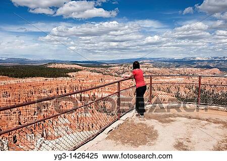Female tourist enjoys view from Inspiration point, Bryce Canyon national park, Utah, USA View Large Photo Image Stock Photography - Female tourist enjoys view from Inspiration point, Bryce Canyon national park, Utah, USA. Fotosearch