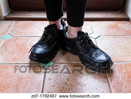 Female wearing male shoes View Large Photo Image Stock Photo - Female wearing male shoes. Fotosearch