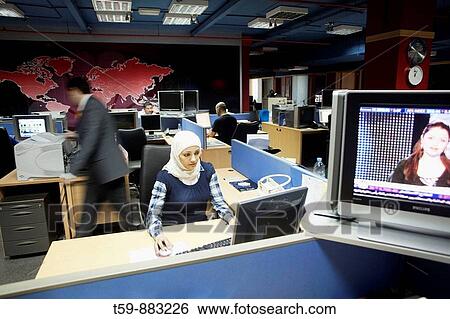 Female Worker at CNBC Studios at Media City, Dubai, UNITED ARABIAN EMIRATES View Large Photo Image Stock Photograph - Female Worker at CNBC Studios at Media City, Dubai, UNITED ARABIAN EMIRATES. Fotosearch