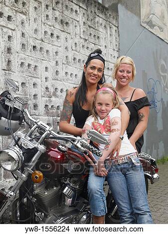 Picture - Females showing off Tattoos, Reykjavik, Iceland. Fotosearch