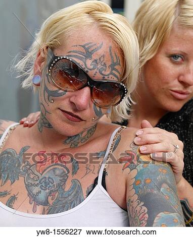 Stock Photo - Females showing off Tattoos, Reykjavik, Iceland. Fotosearch