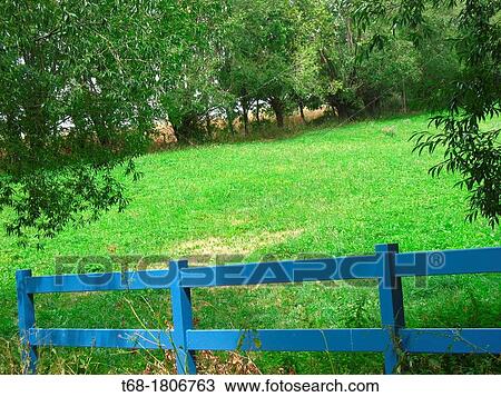 Stock Image - Fence in a meadow French Pyrenees.. Fotosearch