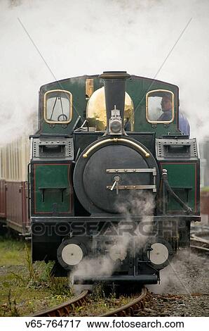 Ffestiniog Narrow Guage railway steam train, leaving Porthmadog, Gwynedd, North Wales View Large Photo Image Stock Photo - Ffestiniog Narrow Guage railway steam train, leaving Porthmadog, Gwynedd, North Wales. Fotosearch