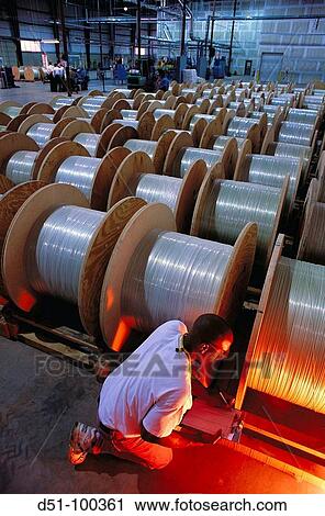 Fiber optics manufacturing plant, worker inspecting fiber optics View Large Photo Image Stock Image - Fiber optics manufacturing plant, worker inspecting fiber optics. Fotosearch