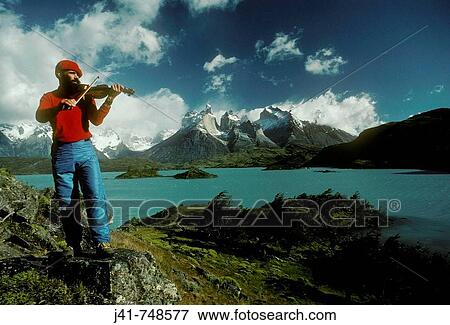 Fiddle player beside Lago Pehoe with view to Cuernos del Paine Torres del Paine National Park Patagonia Chile View Large Photo Image Stock Photo - Fiddle player beside Lago Pehoe with view to Cuernos del Paine Torres del Paine National Park Patagonia Chile. Fotosearch