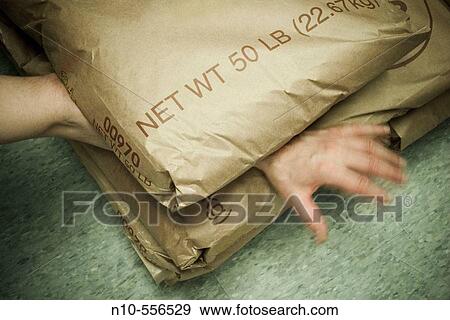 Fifty pound bag of sugar laying on a man's arm and hand. View Large Photo Image Stock Photo - Fifty pound bag of sugar laying on a man's arm and hand.. Fotosearch