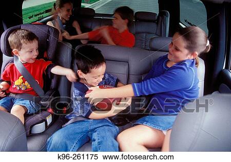 Fighting kids in car View Large Photo Image Stock Photography - Fighting kids in car. Fotosearch
