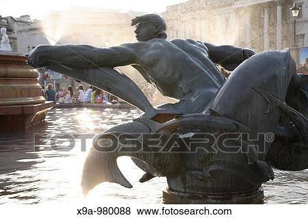 Figure in Trafalgar Square Fountain, London, England, UK View Large Photo Image Stock Photo - Figure in Trafalgar Square Fountain, London, England, UK. Fotosearch