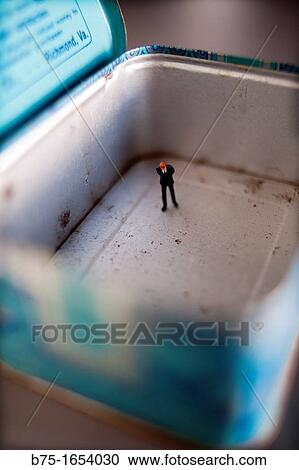 Figure of executive inside tin box View Large Photo Image Stock Image - Figure of executive inside tin box. Fotosearch