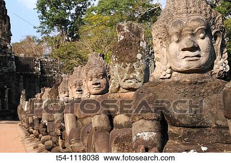 Stock Photo - Figures of Khmer Damons at the Entrace of Angkor Thom. Fotosearch