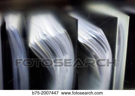 Stock Photo - Files sorted on a shelf in an office. Fotosearch