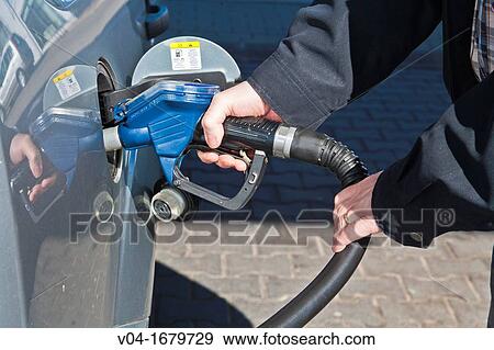 Filling up the tank at a petrol station, Germany, Europe View Large Photo Image Stock Photo - Filling up the tank at a petrol station, Germany, Europe. Fotosearch